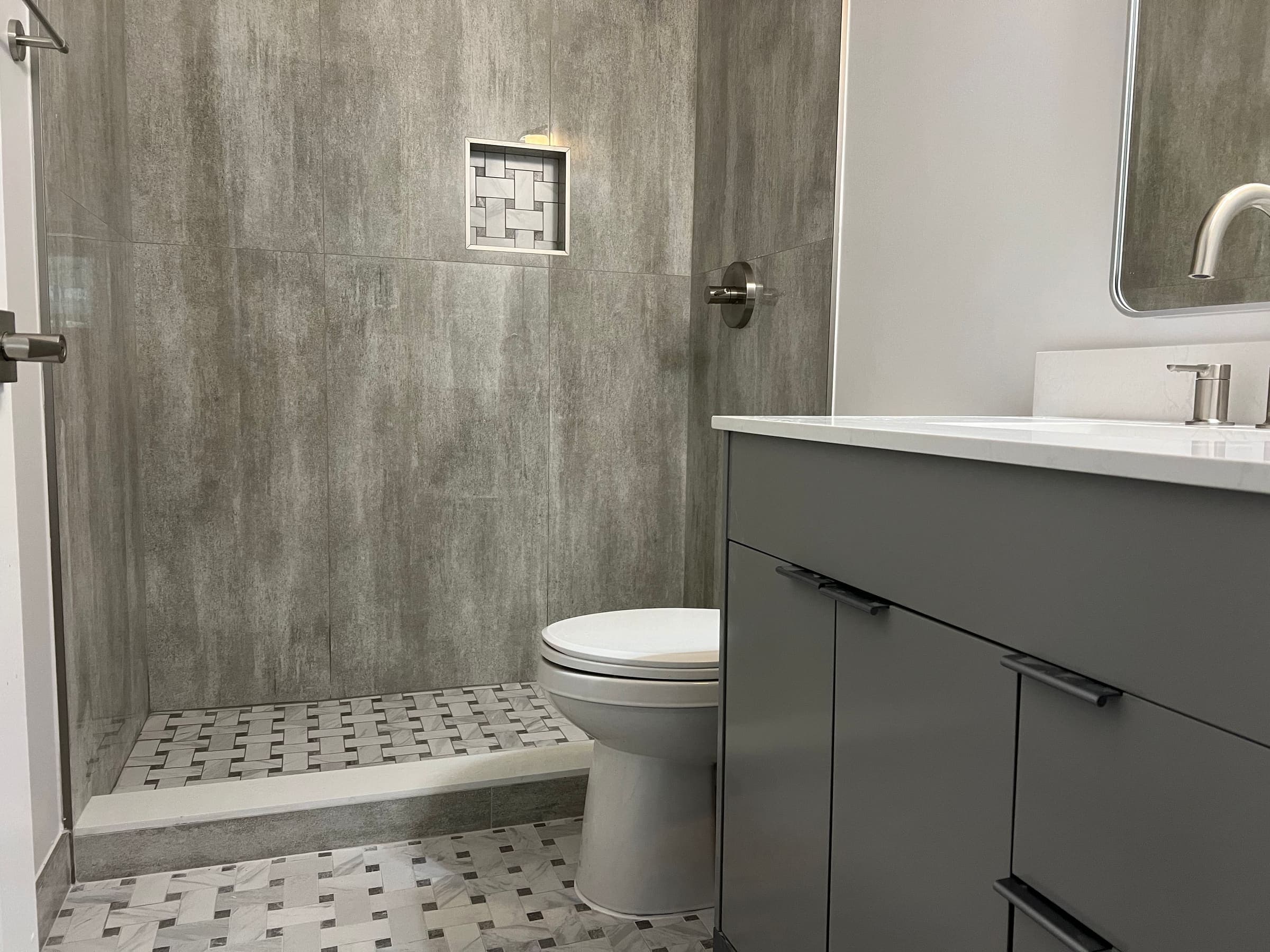 Custom tile work in renovated bathroom